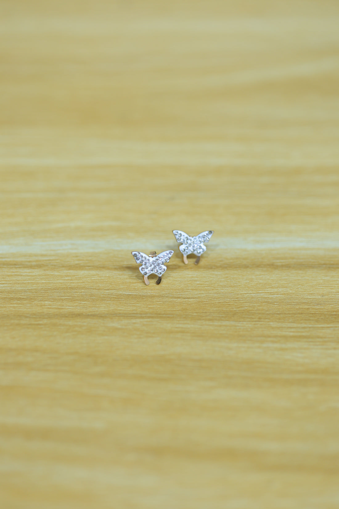 White butterfly studs