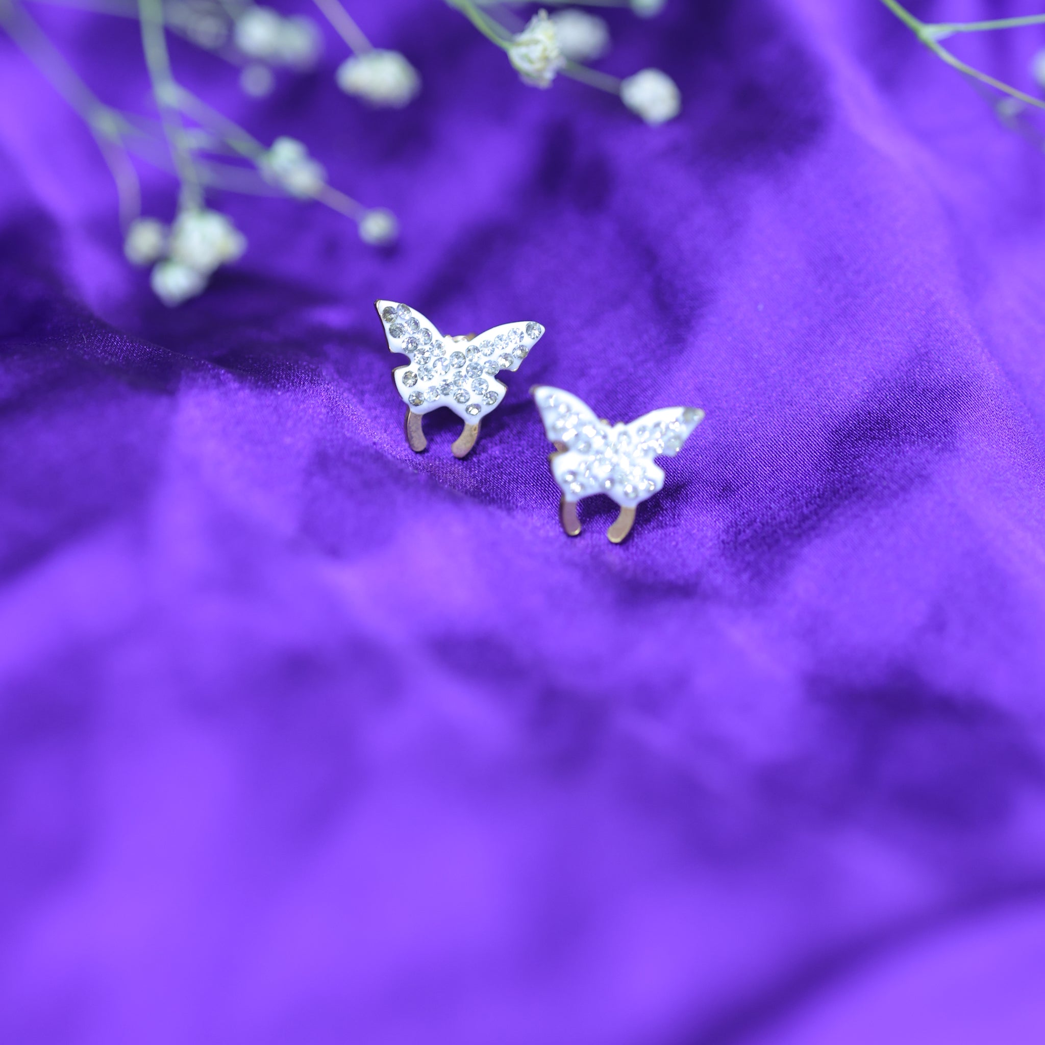 White butterfly studs