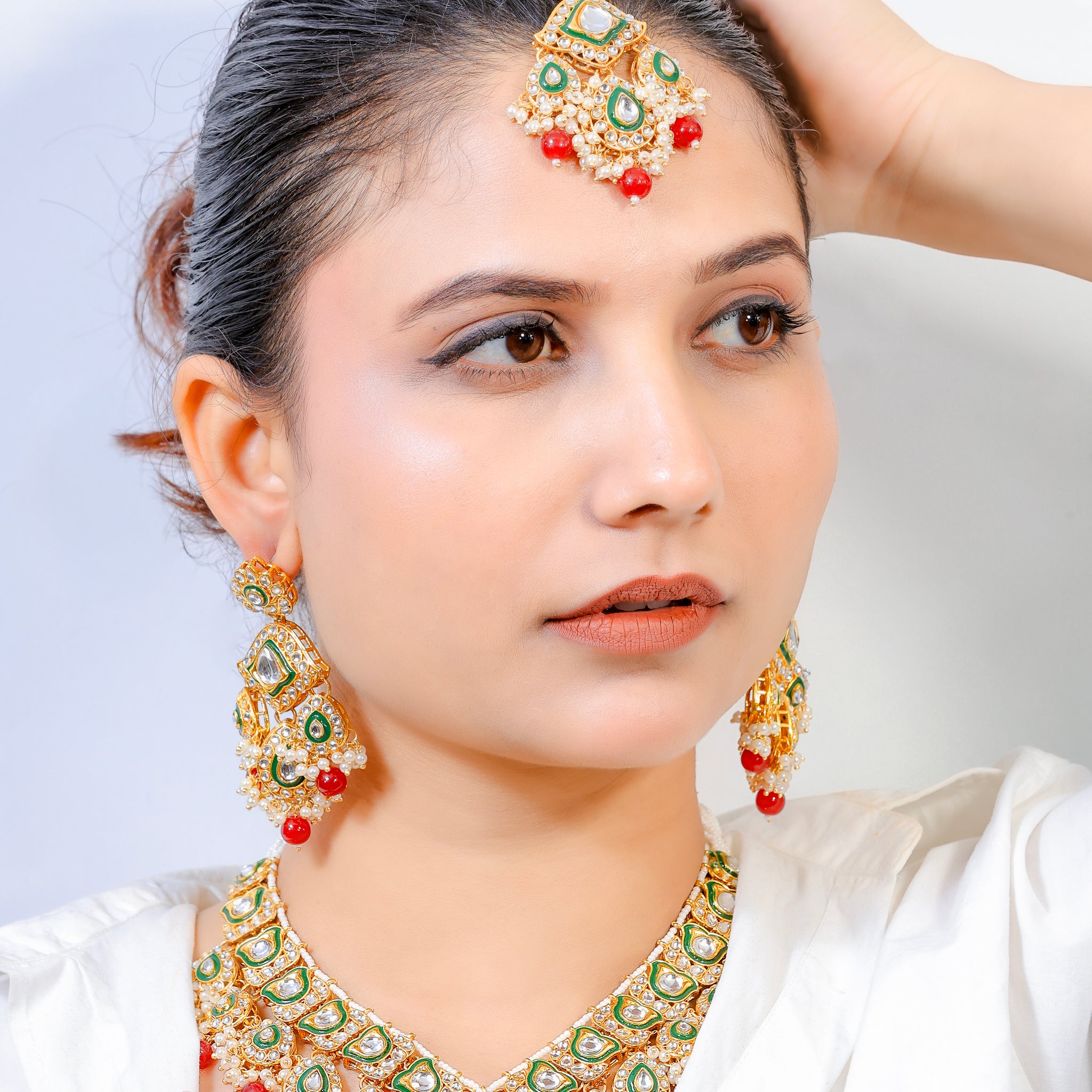 Heeraya – Emerald Kundan Bridal Set with Red Bead Drops