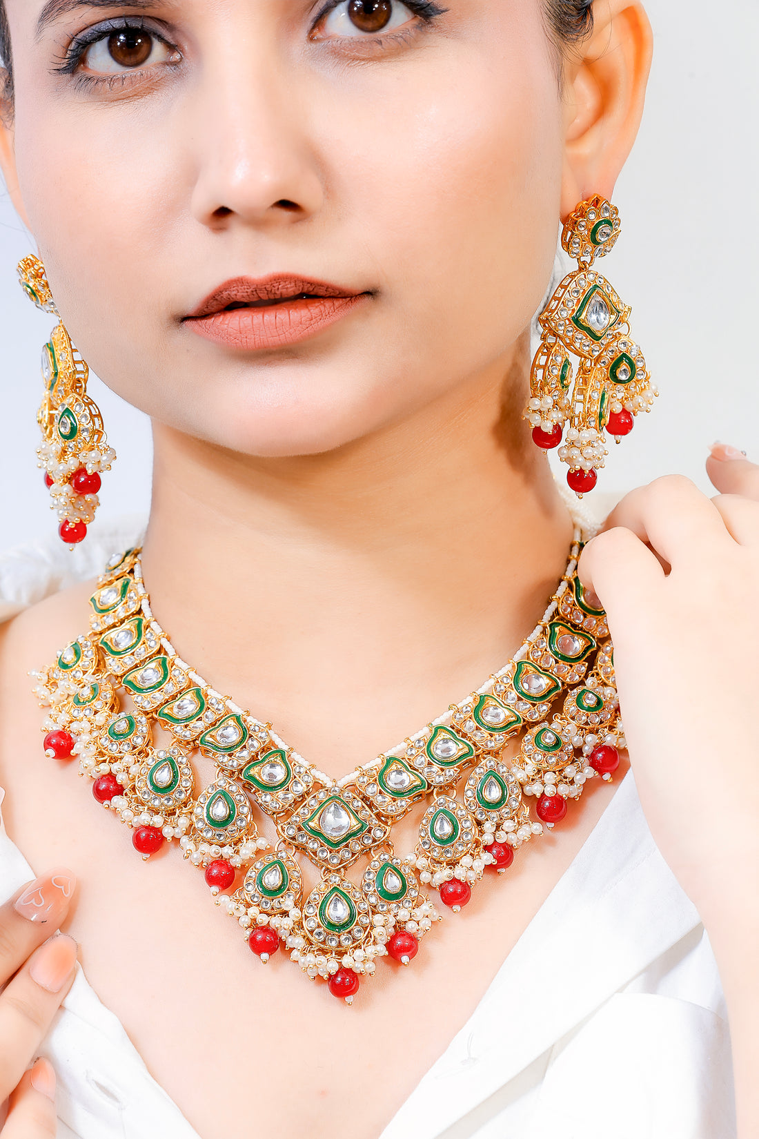 Heeraya – Emerald Kundan Bridal Set with Red Bead Drops