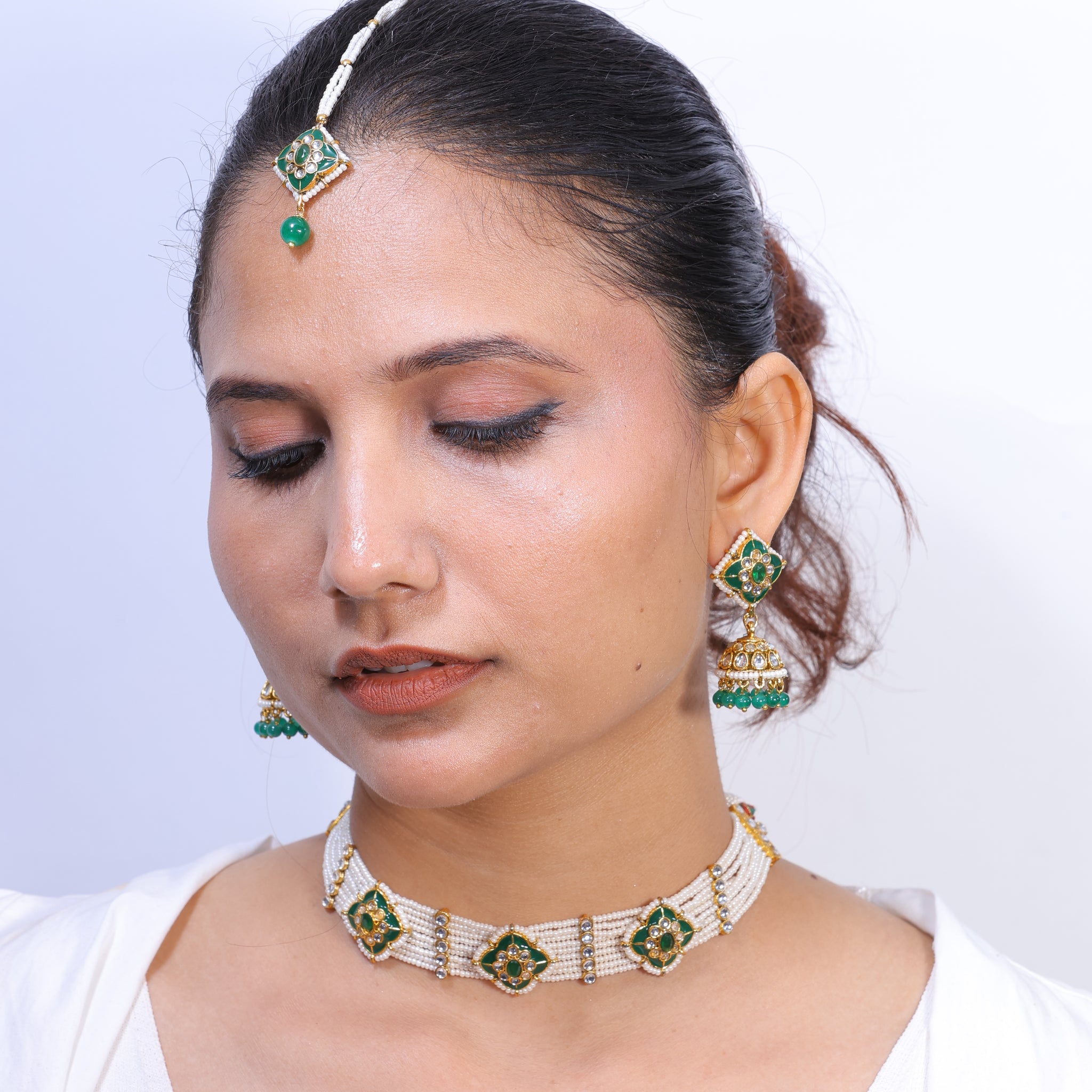 Nehrika– Emerald Meenakari Pearl Choker Set